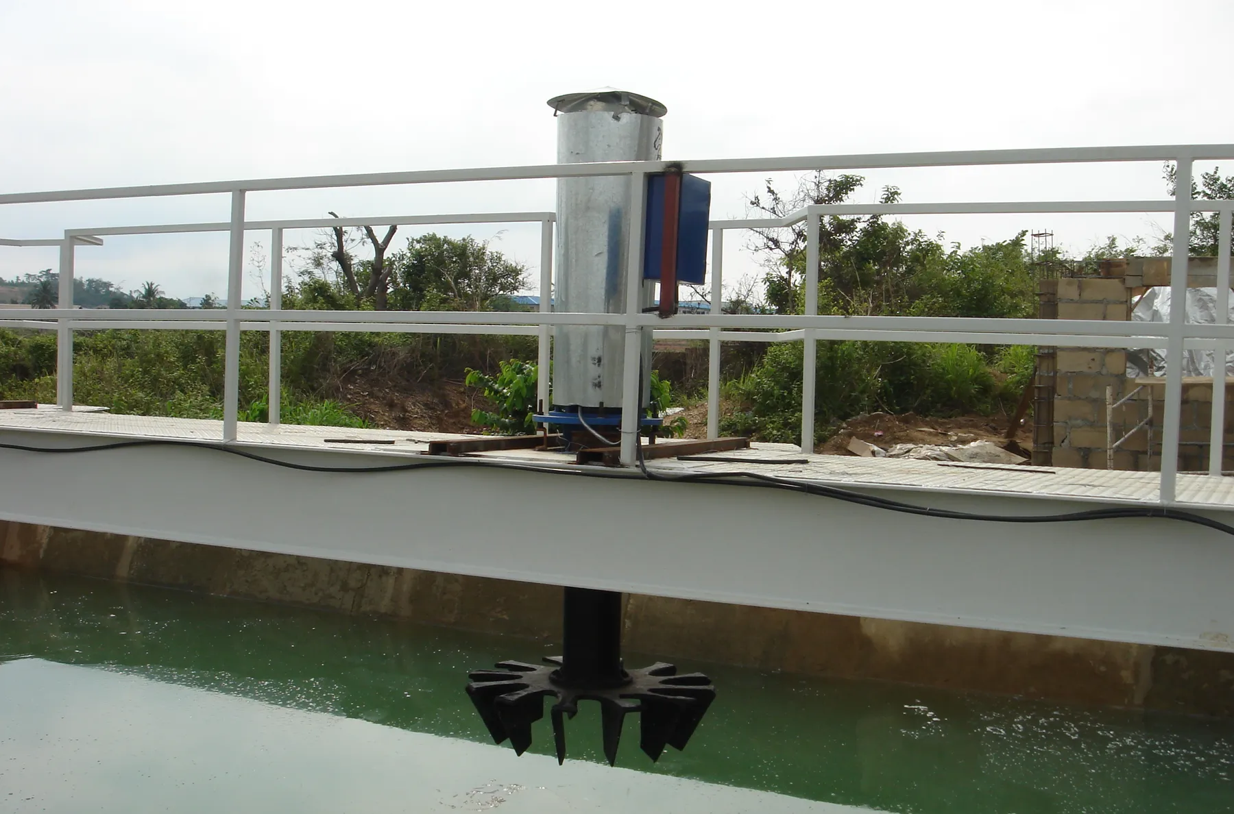Fixed surface aerators on a bridge over the aeration tank
